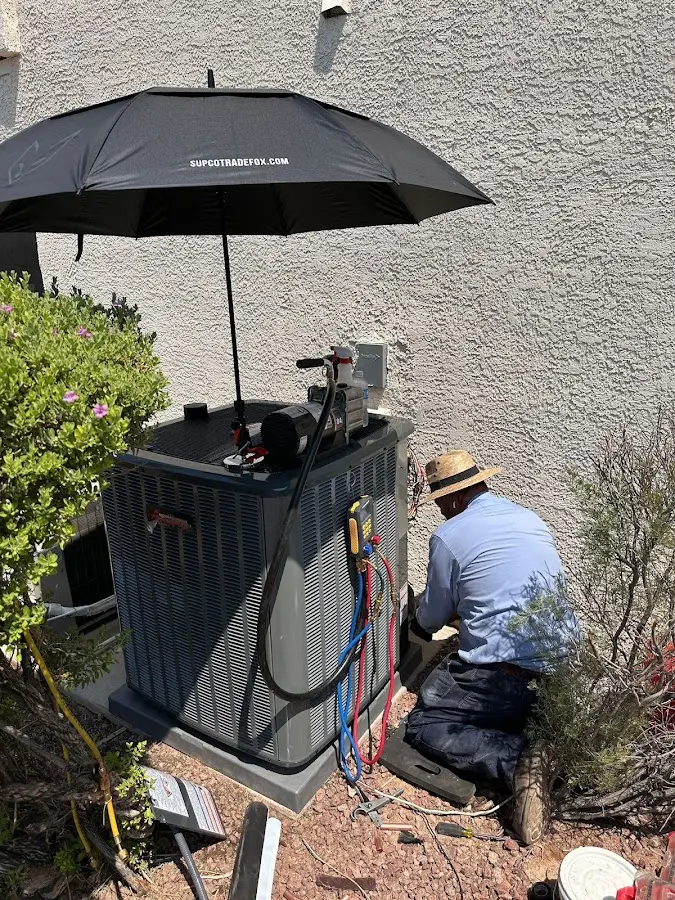 HVAC technician performing outdoor AC maintenance in Meadow Woods